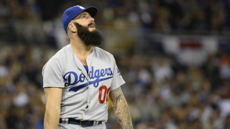 Dodgers relief pitcher Brian Wilson watches a 1-0 lead soar away.